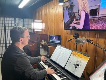Michael Rice teaching an online piano lesson in the Joy in Piano studio